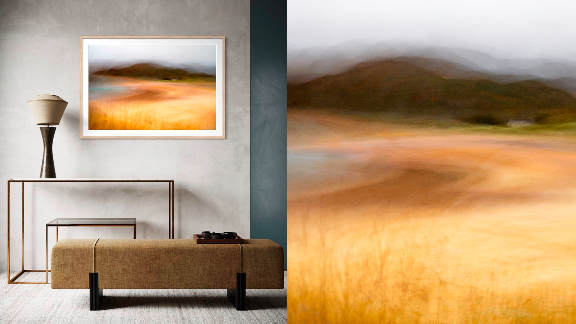 Modern interior with a bench, table, and abstract landscape art on a gray wall.