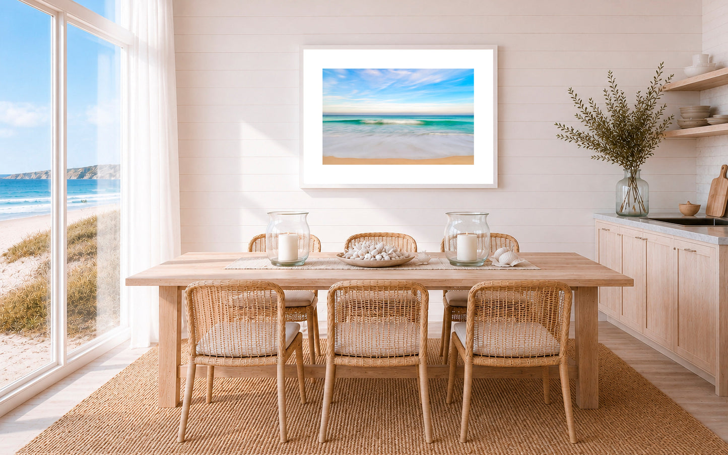 Dining room with coastal view and seaside artwork