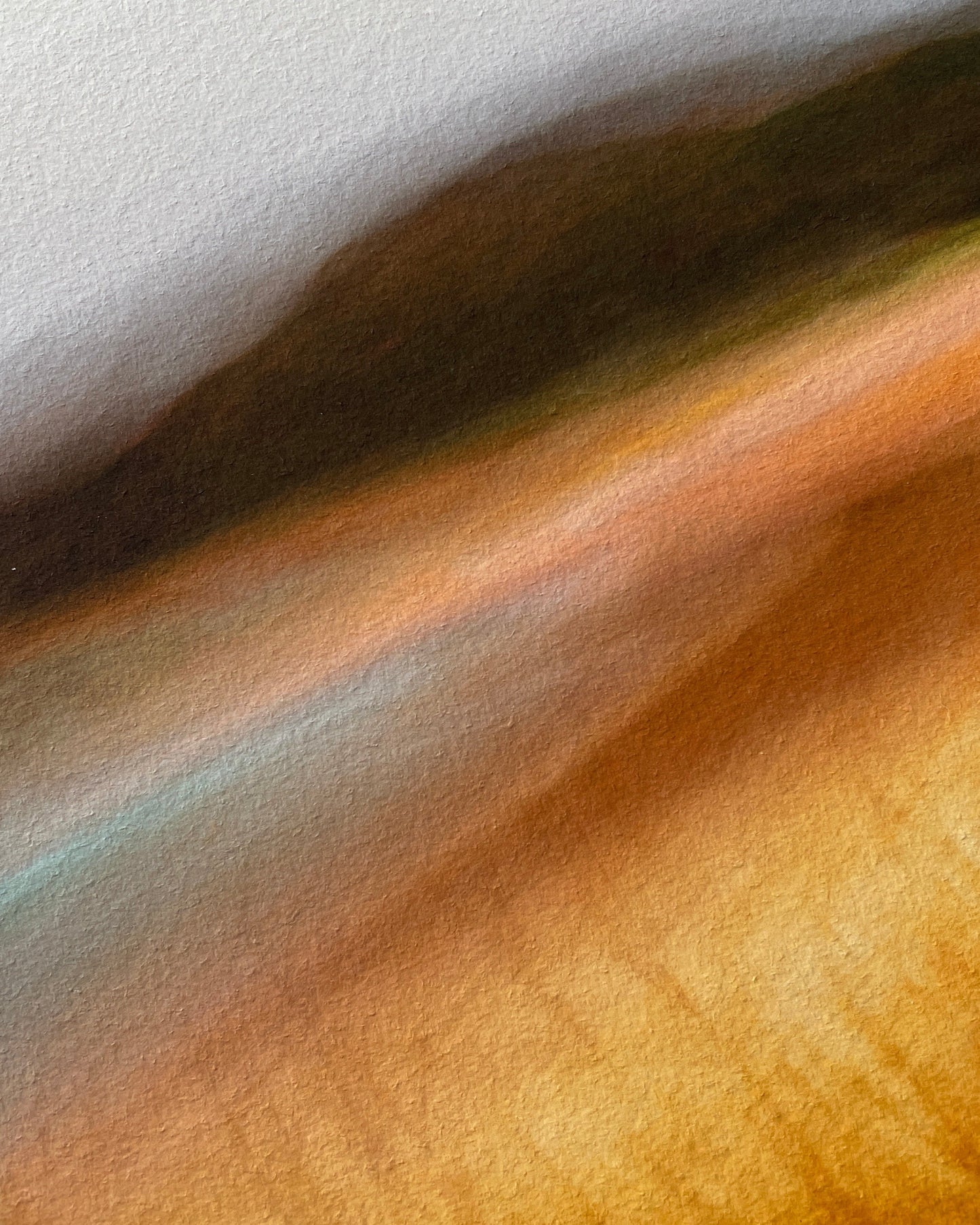 Close-up of seascape wall art with a gradient of colors.