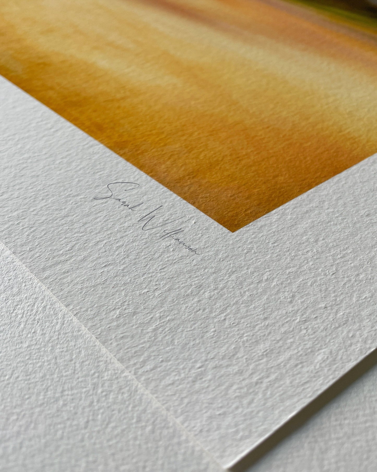 Close-up of hahnemuhle paper with a signature for seascape wall art
